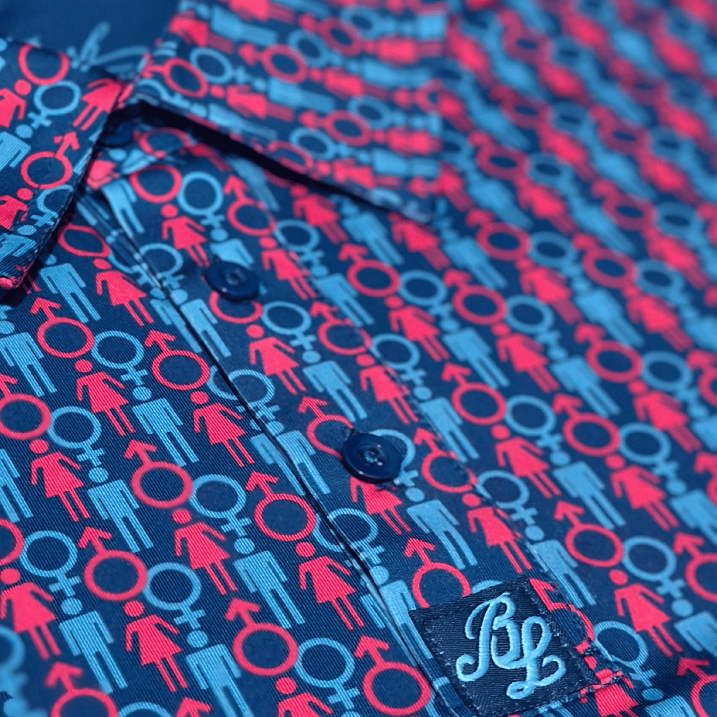 Men's 2 Genders Golf Shit in blue and pink. Close up of placket.