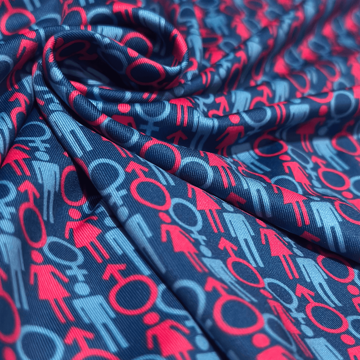 Men's 2 Genders Golf shirt in blue and pink. Close up of polo material.