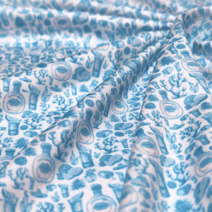 Men's Tequila Golf Shirt in white and blue (blanco) zoomed in on fabric. 